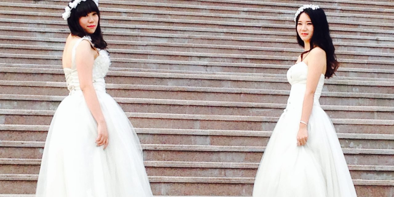 Girls Wear Wedding Gowns for Graduation